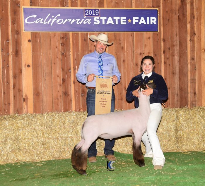 Grand Champion Market Lamb and Exhibitor with Judge