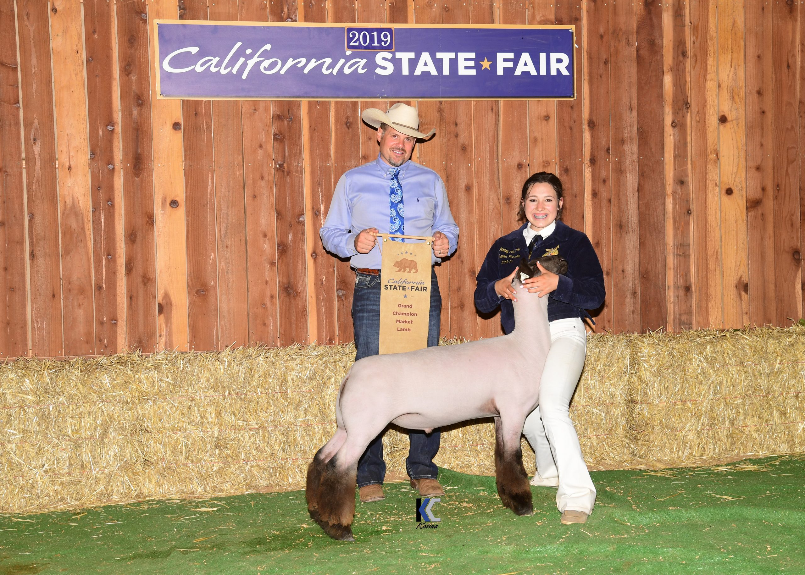 Grand Champion Market Lamb and Exhibitor with Judge