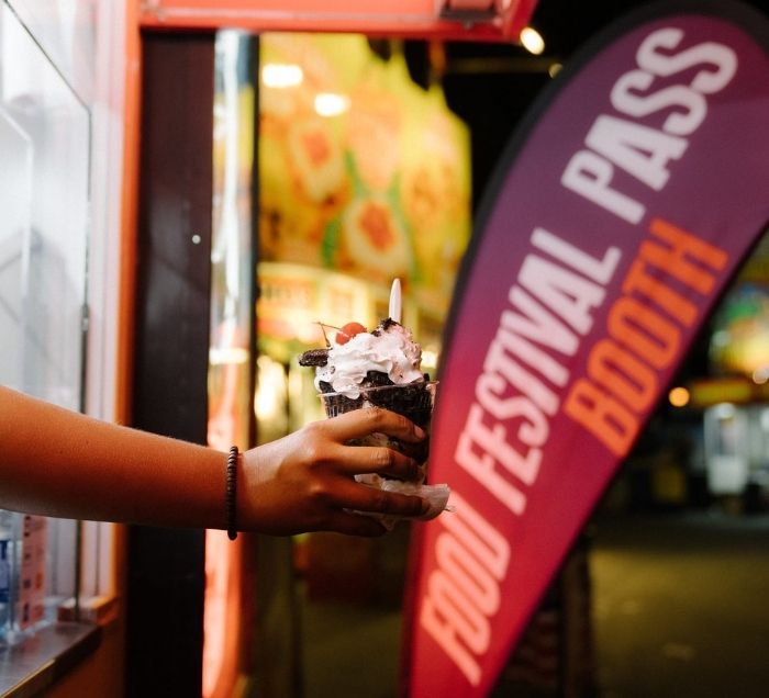 Person holding ice cream for a Food Festival Pass Booth