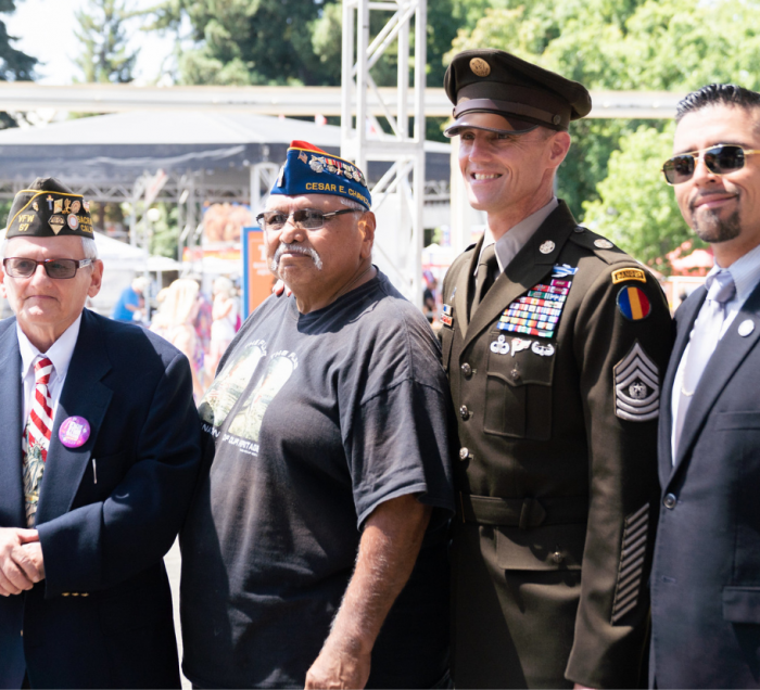 Military and Veterans standing in a group photo