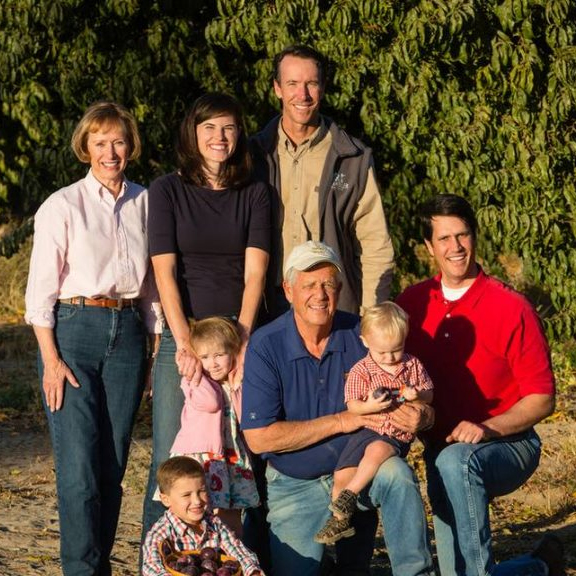Chandler family posing in their farm