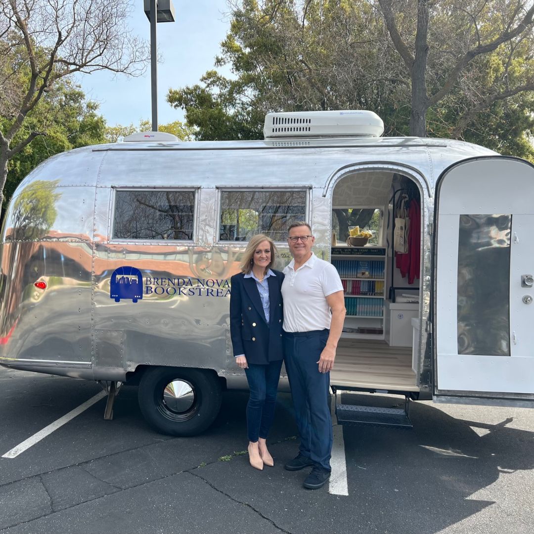 Man and woman standing in front of an airstream